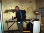 Old tramp in the ruined cottage - with his bottle of course.